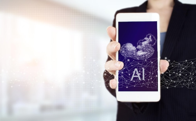 Artificial intelligence AI . Hand hold white smartphone with digital hologram Artificial intelligence polygonal fetus sign on light blurred background.