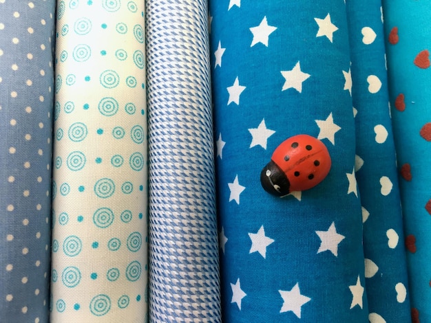 Photo artificial ladybug on fabrics