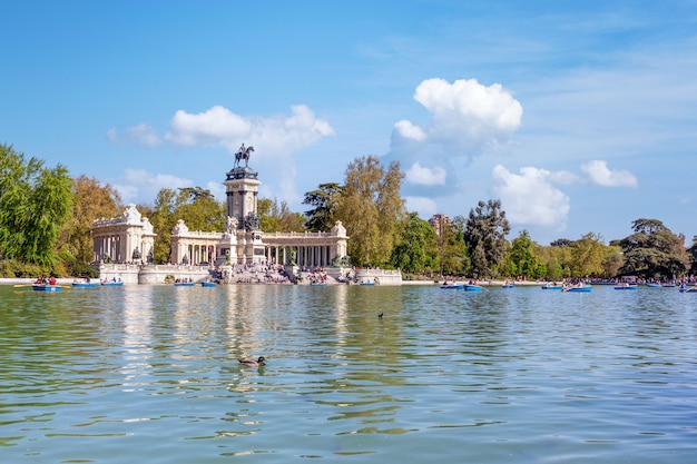 Artificial lake  with people canoeing and enjoying the view in Madrid