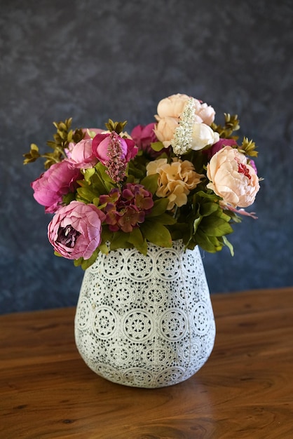 Artificial peonies in vase