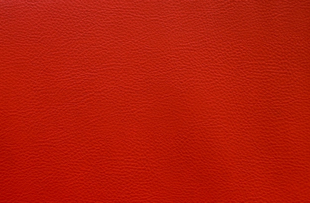 Artificial red leather close up texture background small pattern