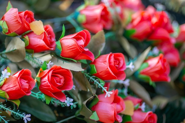 Artificial red roses on a funeral wreath