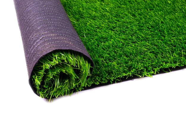 Artificial turf, green grass, roll coverings for sports fields, lawn isolated