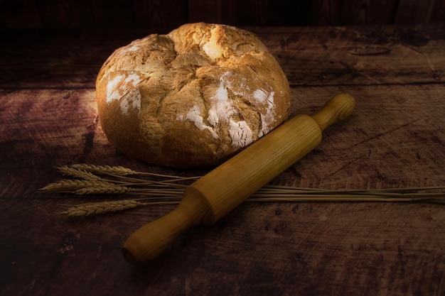 Artisan bread on wooden table.