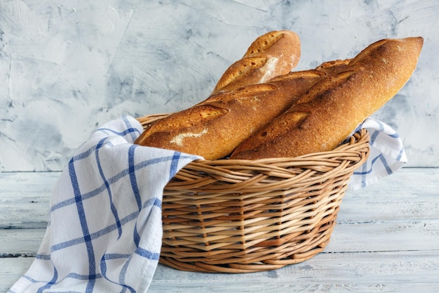 Artisanal baguettes in a wicker basket