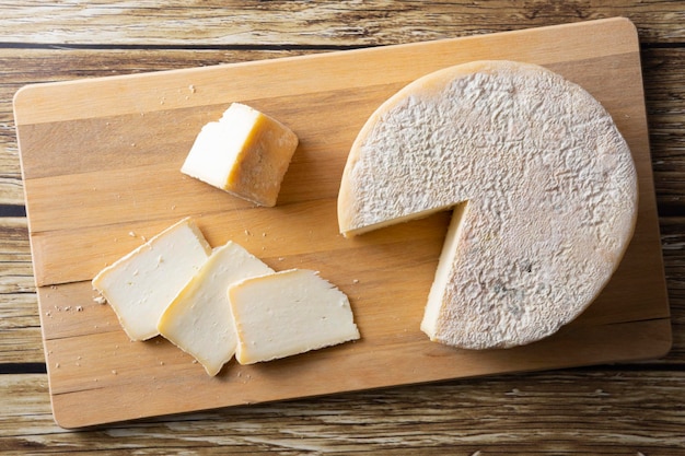 Artisanal Canastra cheese from Minas Gerais Brazil over wooden table