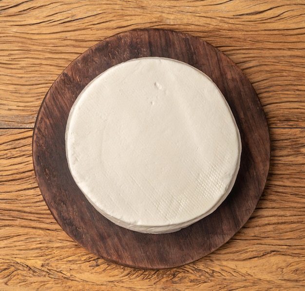 Artisanal fresh Canastra cheese from Minas Gerais Brazil over wooden board