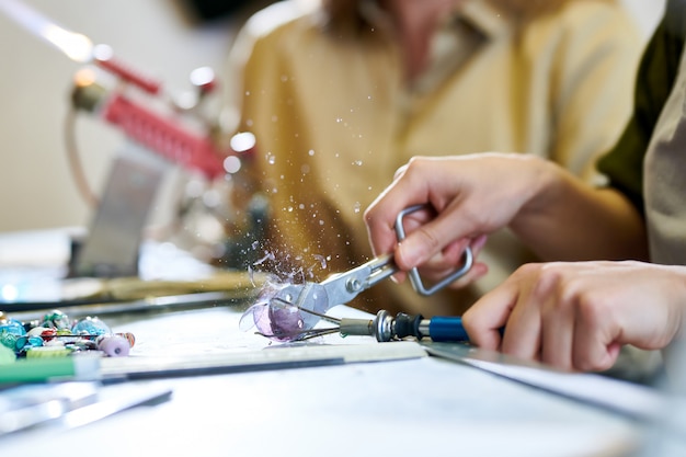 artist breaking glass ball