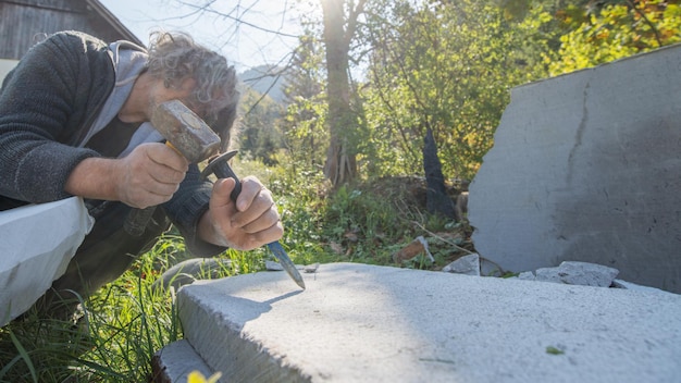 Artist carving in stone with great precision