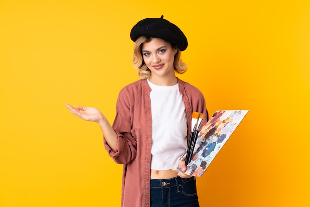 artist girl holding a palette isolate