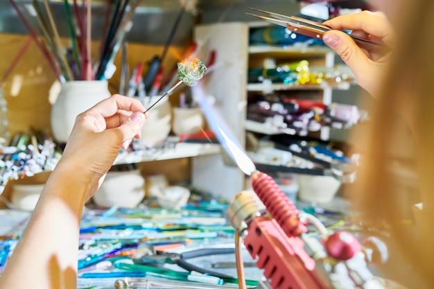 Artist Making Handmade Glass Beads Closeup