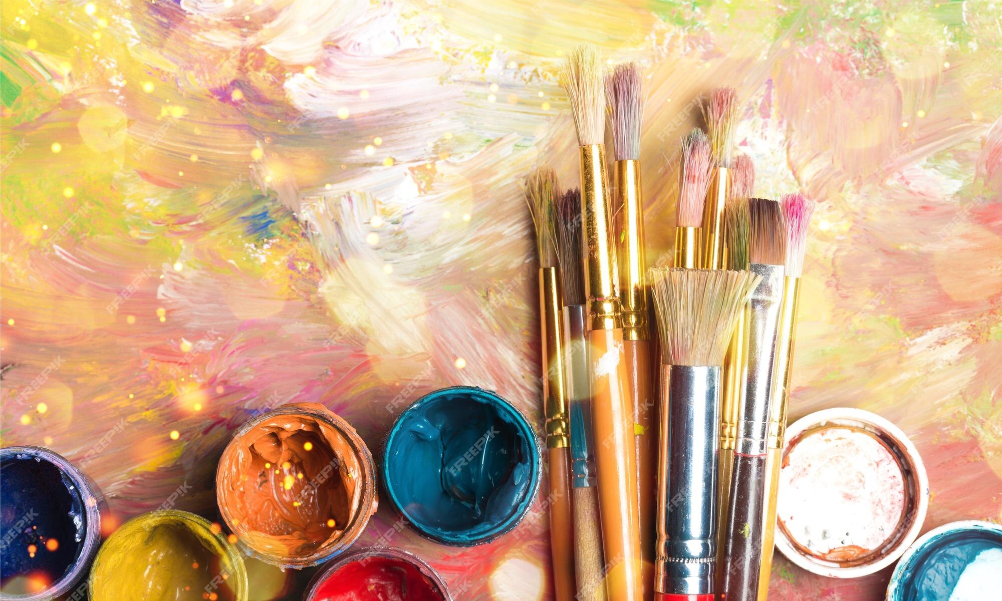 Premium Photo  Artist paint brushes and paint cans of paint over bright  watercolor background