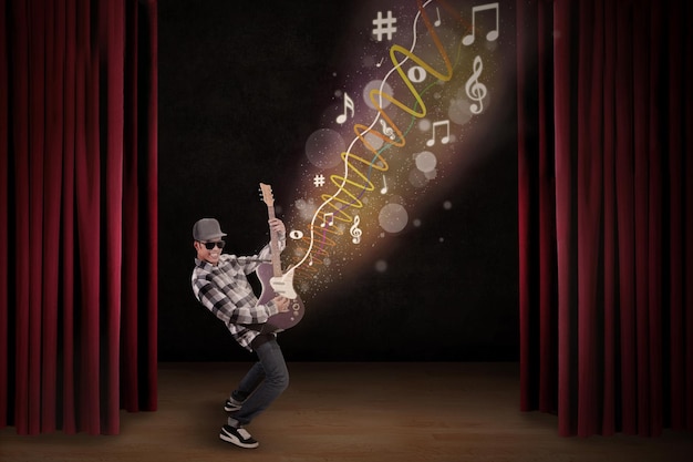 Photo artist perform with guitar on stage