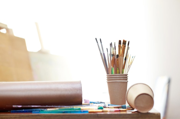 Artist's brushes on a table in the studio closeup