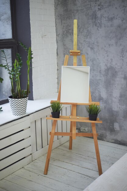 The artist's Studio in the loft Bright room with a large window easel