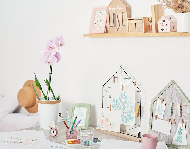 Photo artist's workplace with art supplies brushes, paints and watercolors