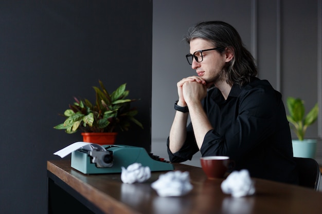 Artist typing a letter at home