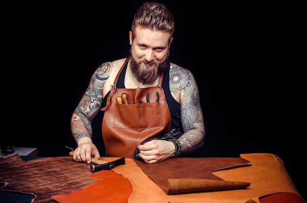 Artist working with leather forms new leather product