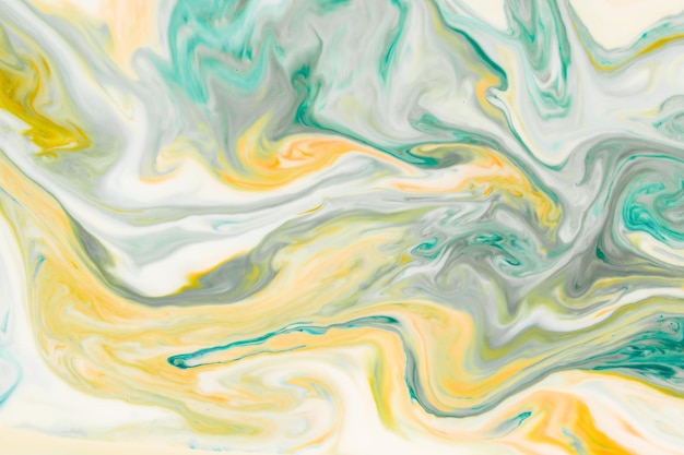 Художественный абстрактный дизайн, созданный путем смешивания цветных жидкостей Красочная фоновая текстура Жидкости смешиваются на поверхности воды