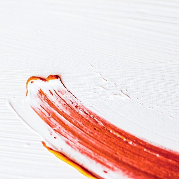 芸術的な抽象的なテクスチャ背景オレンジ アクリル ペイント ブラシ ストローク テクスチャ インク オイル スプラッシュ高級ホリデー ブランド フラットレイ バナー デザインの印刷背景として