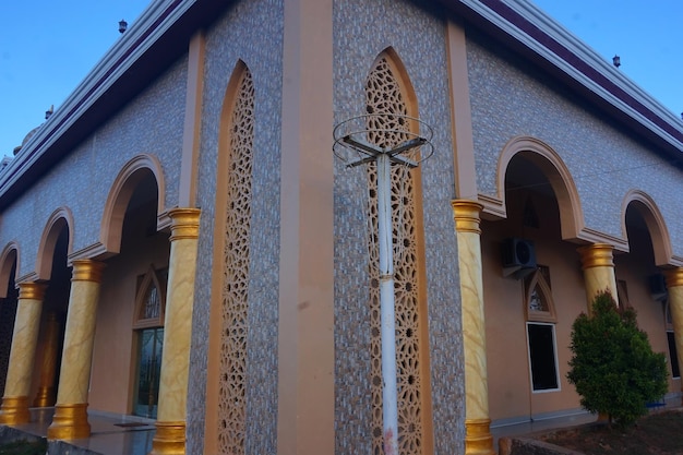 An Artistic Mosque Exuding Tranquility Under a Happy Blue Sky