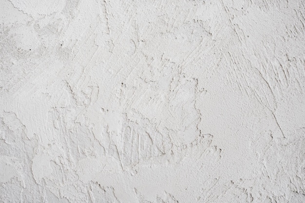 Artistic plaster on a gray and white wall