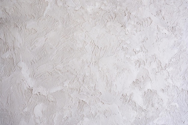 Artistic plaster on a gray and white wall