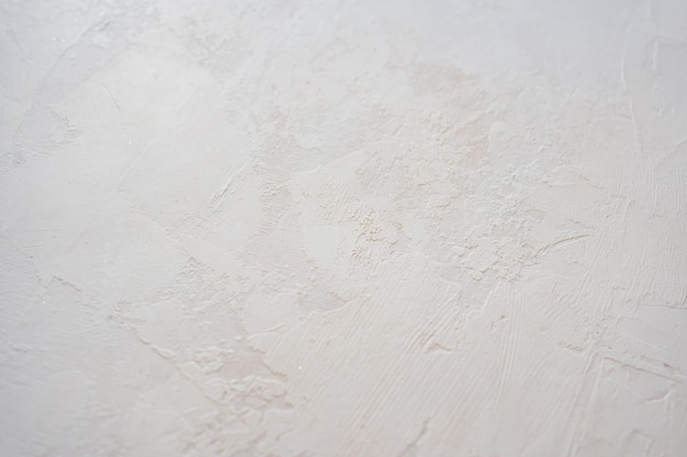 Artistic plaster on a gray and white wall