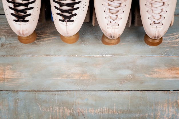 Artistic roller skates on a wood background