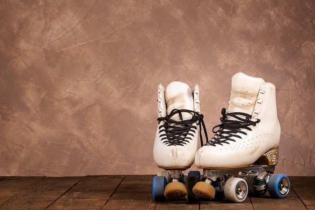 Artistic roller skates on a wood background