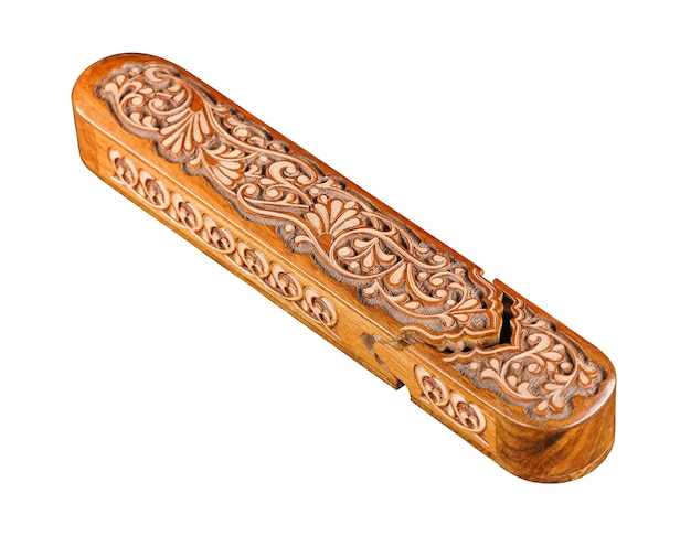 The artistic wood carving on the pencil case on a white background Central Asia Uzbekistan