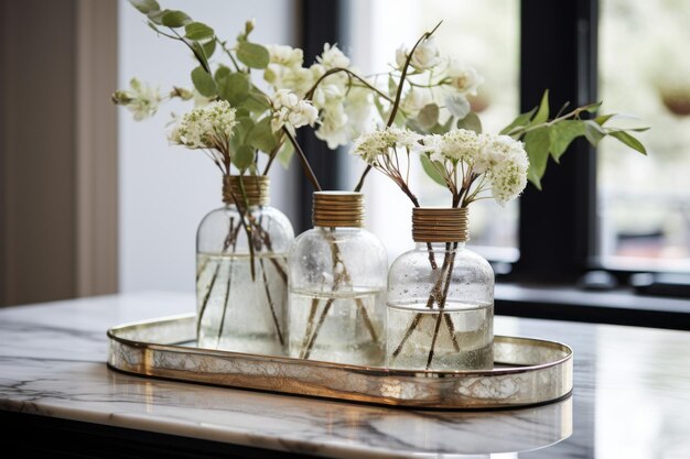 Photo artistically displayed chic clear glass vases on a marbled tray ar 32