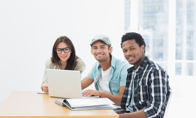 Artists working at desk in creative office