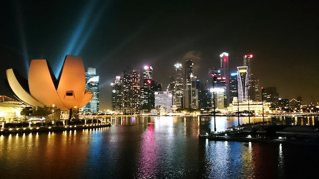 Artscience museum in illuminated city at night