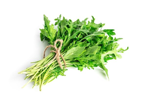 Arugula isolated on white background. A bunch of arugula. High quality photo