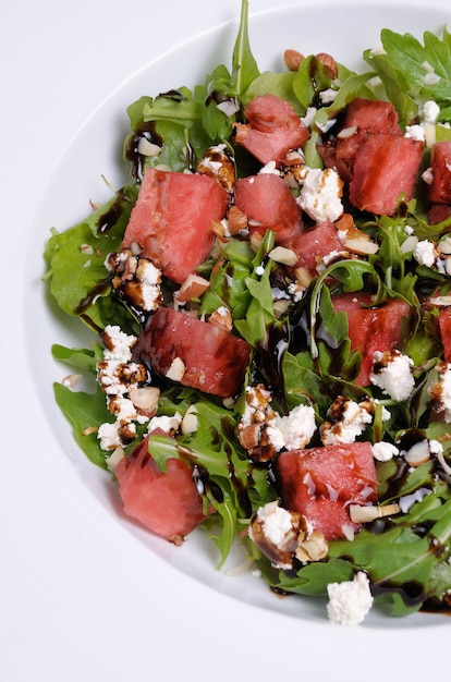 Arugula salad ricotta cheese with watermelon slices  balsamic soy sauce