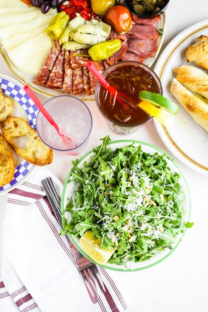 Arugula salad with pine nuts on the plate in Italian restaurant.