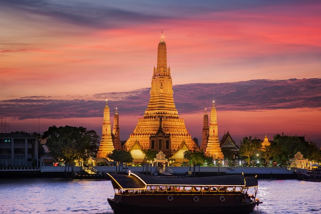 Arun Temple with sunset and wooded vintage boat