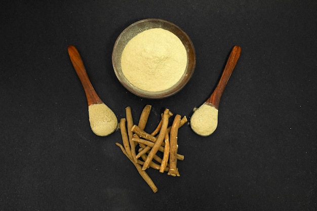 Photo ashwagandha or aswaganda or indian ginseng is an ayurveda medicine in stem and powder form