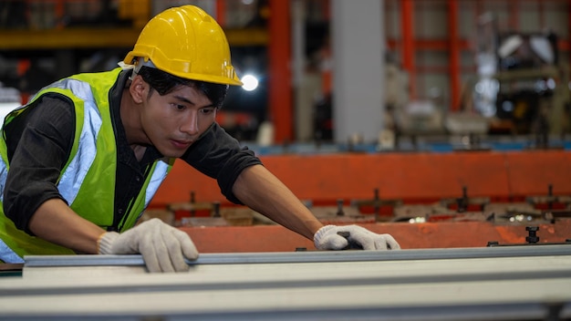 Asia Heavy industry Foreman factorial worker check metal steel roof after production in manufacturing factory production line