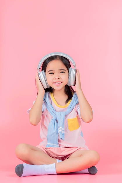 Asia little girl cute put on headphones