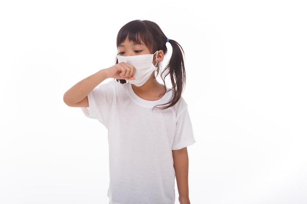 Photo asia women wearing mask to prevent the virus pm25 coronavirus 2019ncov asian little girl feeling unwell and coughing as symptom for cold or pneumoniabronchitis healthcare concepton white background