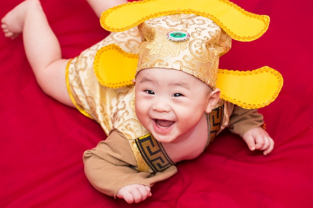 Asian baby in costume king of china cosplay