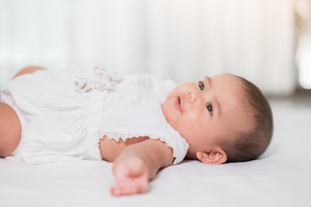 Asian baby cute in the living room at home with family.