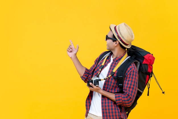 Asian backpacker being enjoyed with his travelling 