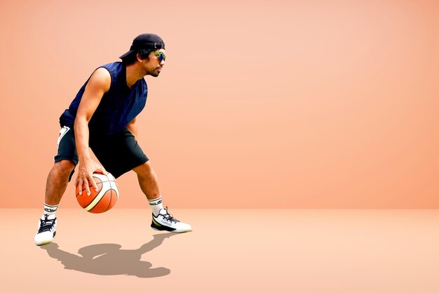 Photo asian basketball player on colored background