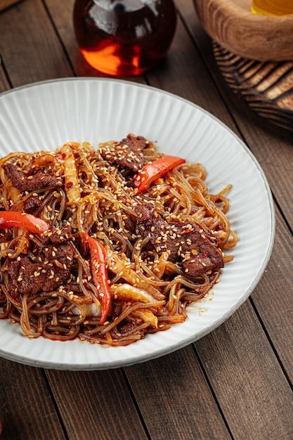 Asian beef soba noodles with peppers and sesame