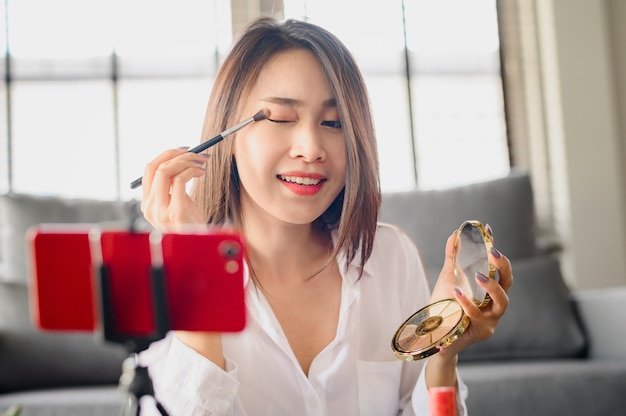 Asian blogger woman recording video makeup cosmetic