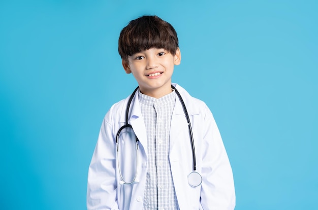 Asian boy portrait posing on blue background