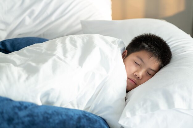 Asian boy sleep on bed child sick kid sleep